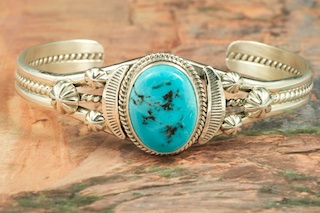 Genuine Sleeping Beauty Turquoise set in Sterling Silver Bracelet. The Sleeping Beauty Turquoise mine is located in Gila County, Arizona. Created by Navajo Artist John Nelson. Signed by the artist.